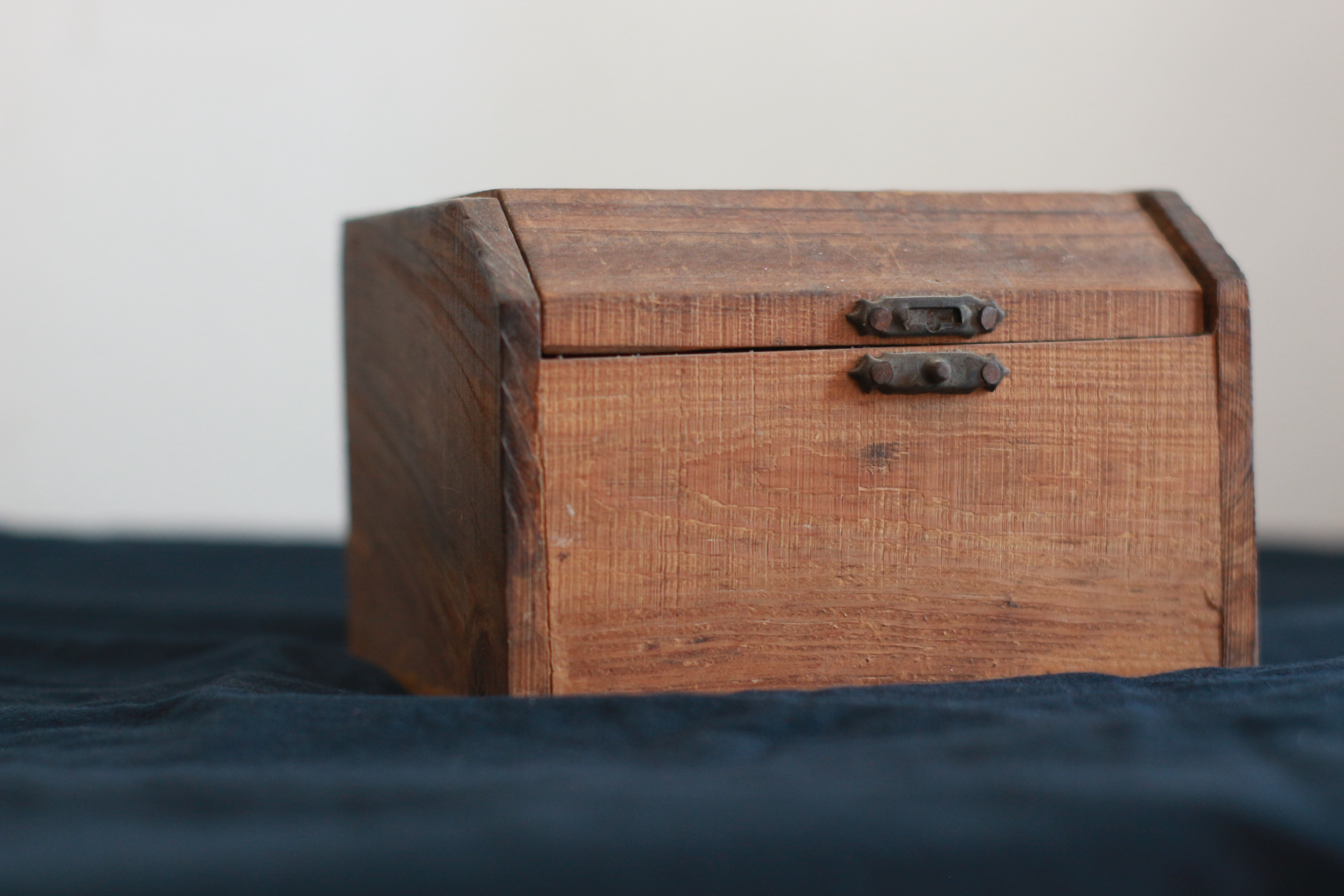 A handmade wooden box with a missing latch
