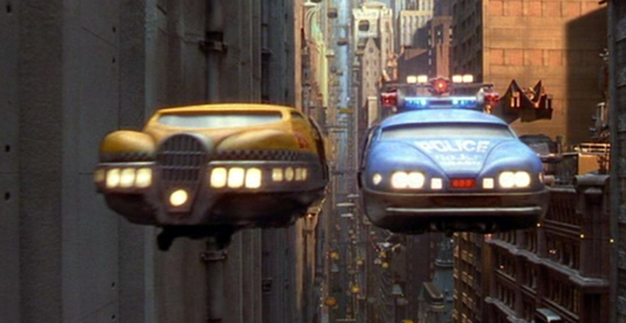 Fifth Element flying taxi next to a flying police cruiser
